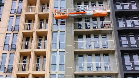 Front view of a new modern building. Construction of a high-rise apartment.  alt