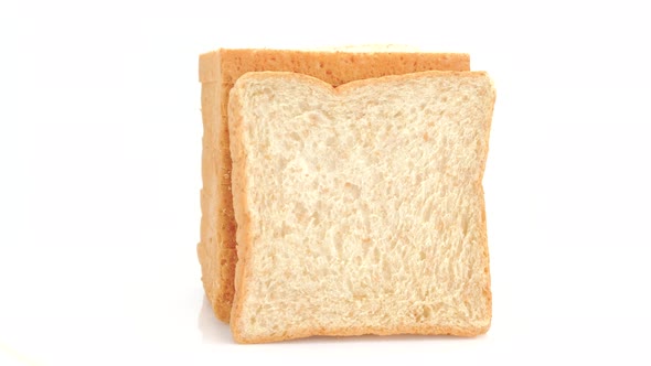 Whole wheat bread rotation isolated on white background, Close up alt