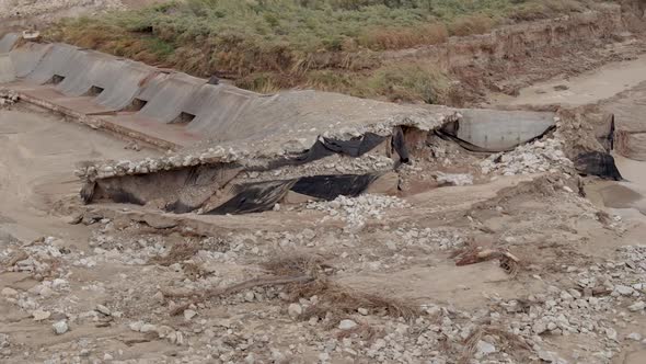 View of flood aftermath as river reroutes around spillway dam in Utah alt