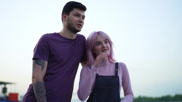 Portrait of Happy Smiling Young Tattooed Boyfriend and Charming Cheerful Girlfriend with Pierced alt