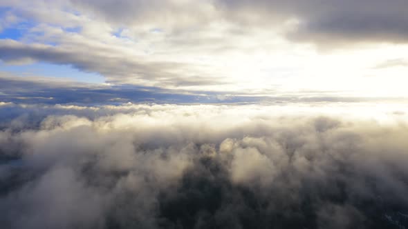 Flight through the moving cloudscape. Texture of clouds. Panoramic view. Clouds in motion	