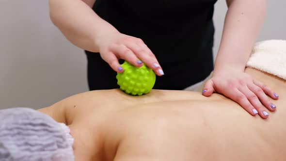 Woman at the Physiotherapy Receiving Ball Massage From Therapist alt