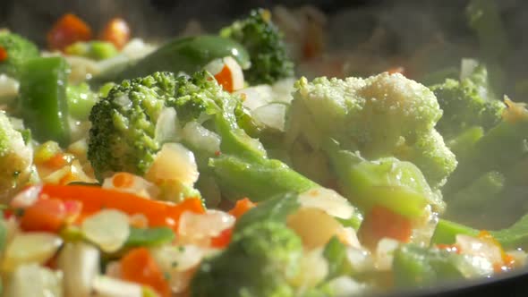 Lunch of Vegetables. Cook the Vegetable Stew in a Pan. Frozen Vegetables on a Salad. Semi-finished