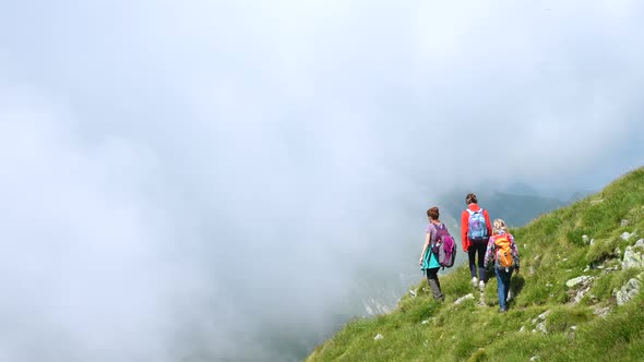 Family Hiking At The Mountains alt