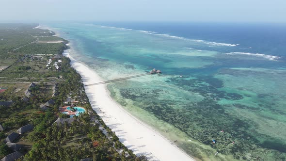 Aerial View of a House on Stilts in the Ocean on the Coast of Zanzibar Tanzania Slow Motion alt