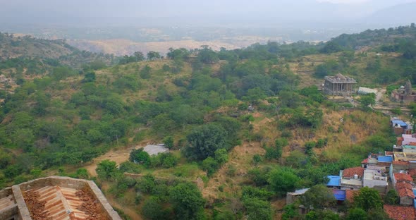 Kumbhalgarh Fort and Indian City Kumbhalgarh Aerial View. Trees and Fortress Ancient Walls on alt
