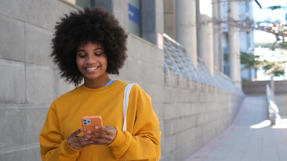 Beautiful Woman Using Phone Walking On Street. Portrait Of Stylish Smiling Business Woman alt