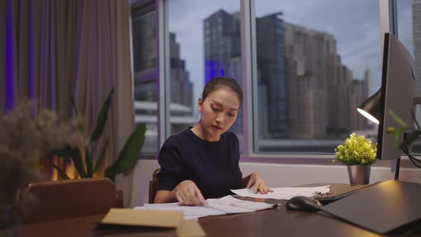 Asian  home working late at night. alt