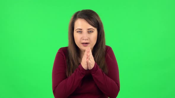 Portrait of Pretty Girl Froze and Trying To Keep Warm. Green Screen alt