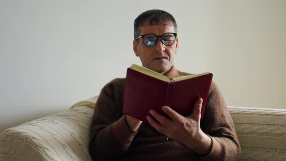 Old Man Asian Professor Historian Reading Old Book at Home alt