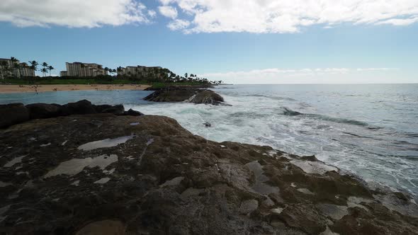 Waves crashing over Oahu's the volcanic rocks. alt