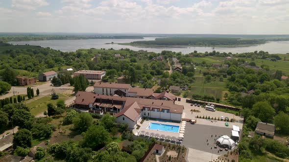 Aerial View of a Small Hotel with Blue Swimming Pool and Landscape Design alt