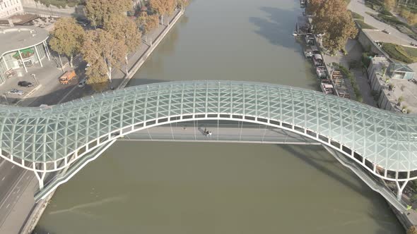 Aerial view of Tbilisi city central park and Bridge of Peace alt