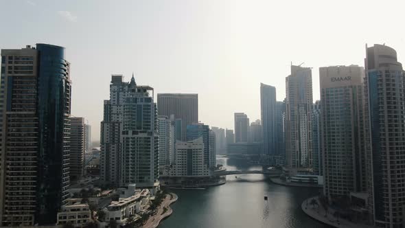 Drone View on Dubai Creek with Boats Bug Modern Skyscrapers Dubai UAE alt