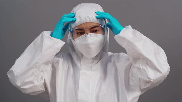 stressed doctor in protective PPE suit during coronavirus(covid-19) pandemic