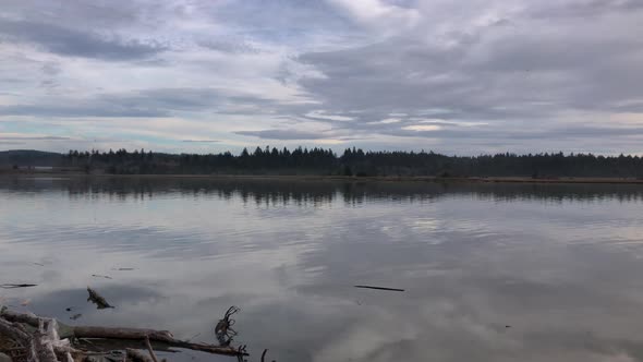 Beautiful Coquille River in Southern Oregon near Bandon with clouds reflecting in the water at high  alt