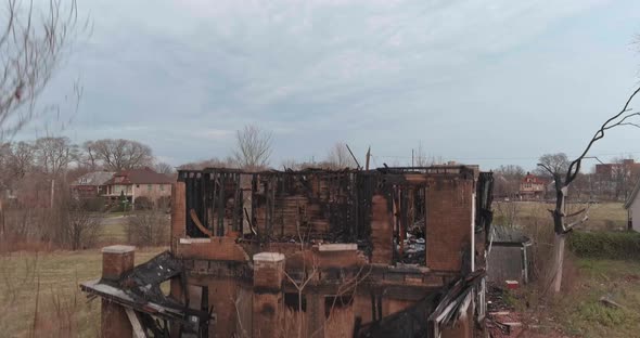 Drone view of dilapidated house in a Detroit neighborhood. This video was filmed in 4k for best imag alt