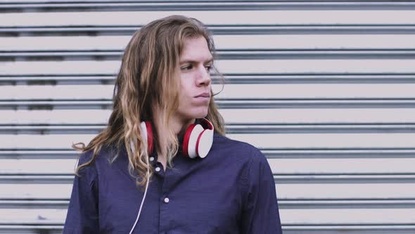 Portrait of adult male on street looking to camera