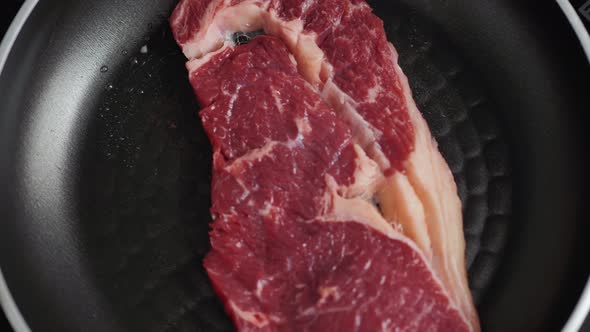 Cooking Rib Eye Steak with Herbs on Grill Pan Close Up Macro Pan Fresh alt