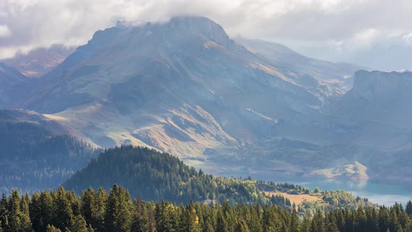 Mountains with clouds and a lake alt