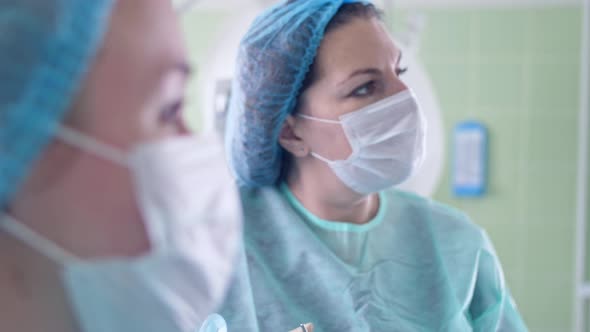 Surgeon Woman Performs Surgery on Patient