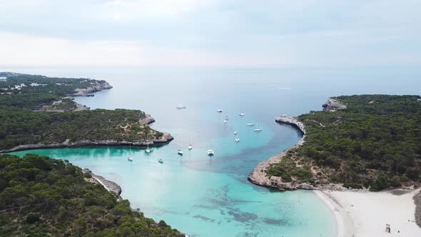 Aerial: The beach of Cala Mondrago in Mallorca, Spain alt