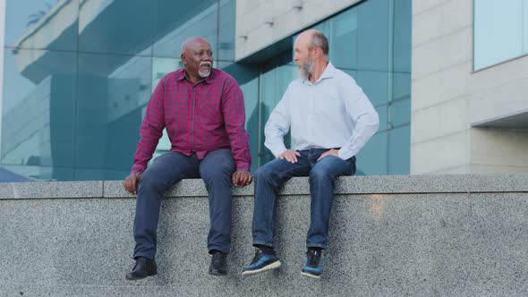 Two Bearded Men of Retirement Age Elderly Male Friends Old Colleagues or Mature Businessmen Sitting alt