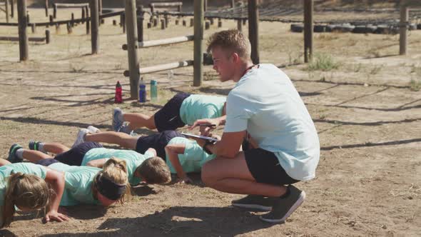 Group of Caucasian children training at boot camp alt