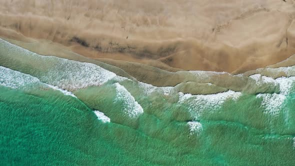 Top view on the Lofoten beach and sea waves