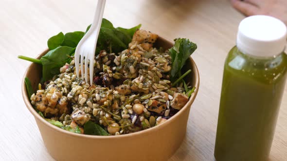 Hand Eating a Salad with Fork alt