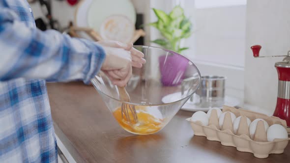 Mixes the Ingredients for Pancakes