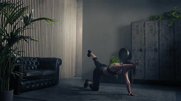 Athletic Young Woman Training Bird Dog at Home in Sportswear alt