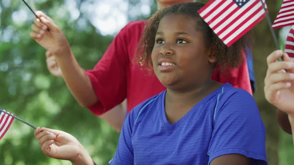 Kids waving flags on Fourth of July