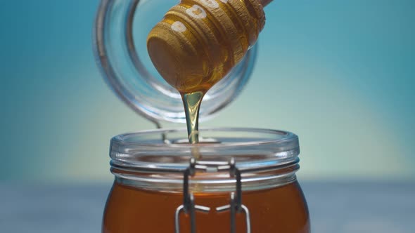 Pouring Fresh Honey on Blue alt