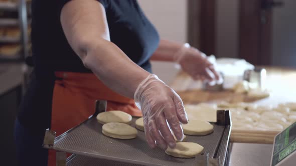 The Chef Is Putting the Round-shaped Pastry on a Support. alt