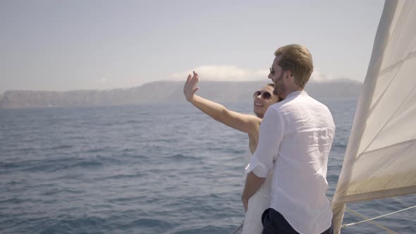 Honeymoon Couple Sailing With Catamaran