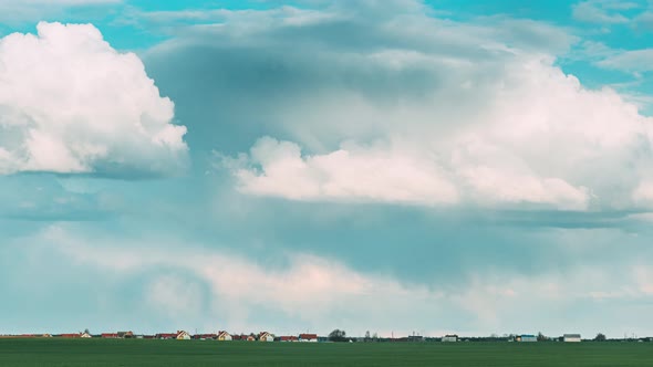 Countryside Rural Field Landscape With Young Green Wheat Sprouts In Spring Springtime Summer Cloudy alt