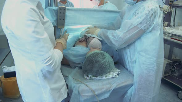 Woman Gives Birth on a Hospital Table alt