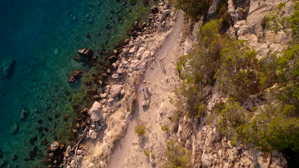 Vertical View of the Sea Coast and Cliffs From Drone at Sunset