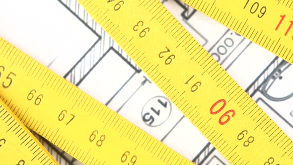 Yellow Folding Rule on Building Plan, Rotation, Close Up alt