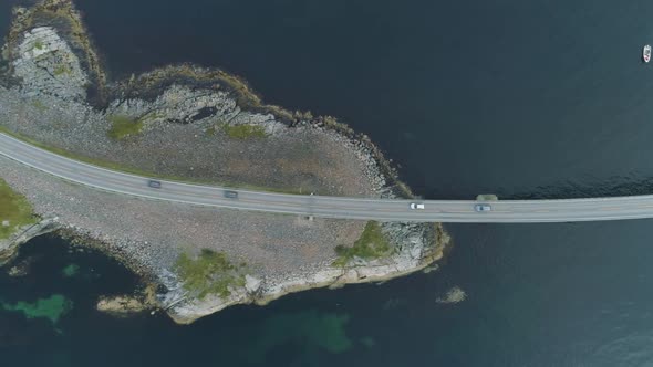Cars Are Going on Atlantic Ocean Road in Norway. Aerial Vertical Top-Down View alt