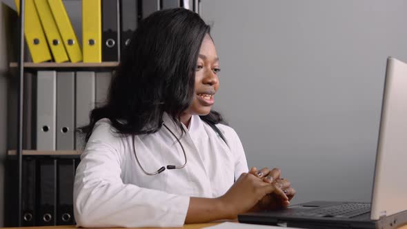 Young African American Female Doctor Make Online Video Call Consult Patient alt