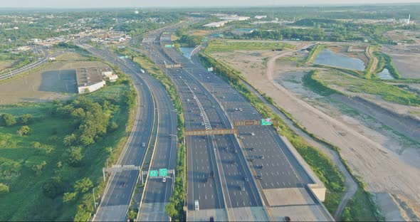 Aerial Top View of Huge Complex Road Junction at Cars Driving on the Alfred E alt