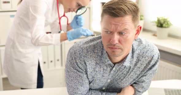 Doctor Proctologist Taking Out Toy Car From Rectum of Male Patient  Movie Slow Motion alt