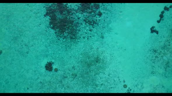 Aerial travel of luxury coast beach trip by blue water and white sand background of a dayout near sa alt