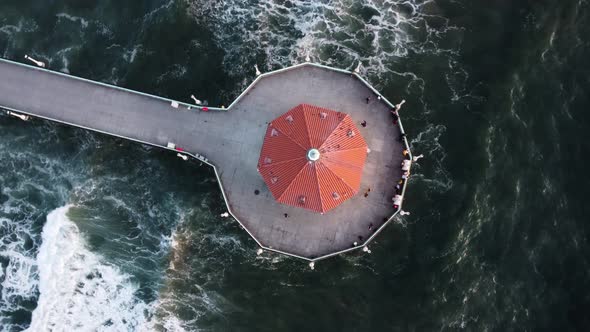 The Roundhouse Aquarium and Pacific Ocean in Manhattan Beach, California. Aerial orbit shot alt