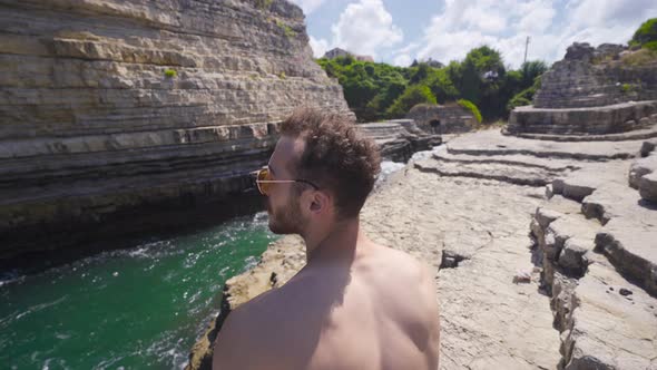 Sitting on the rocks at Sea Bay. alt