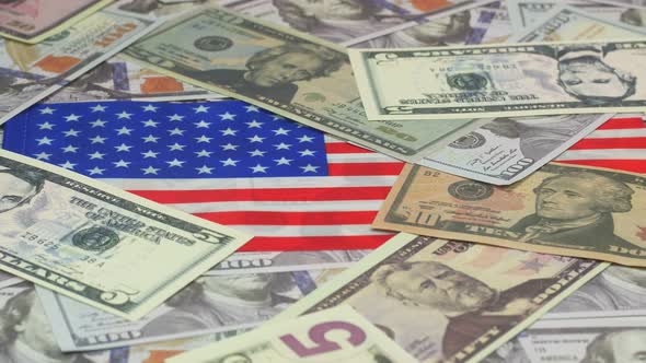 Us Dollar Banknotes And American Flag