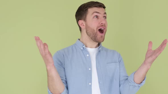 The Young European is Shocked and Shocked By the Words WOW Joy on a Man's Face Close Up alt