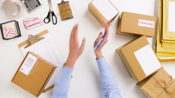 Woman Signing Parcel Boxes at Post Office 6 alt